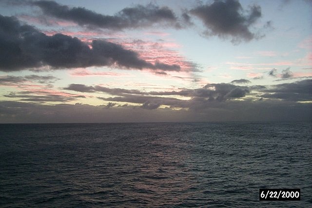 Crimson sunset over the ocean on the way to Bora Bora