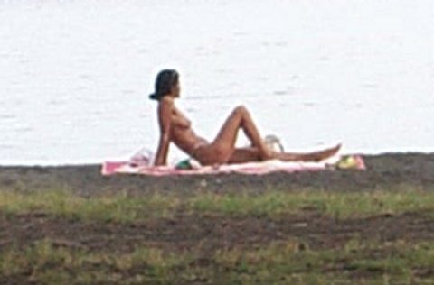 Topless sunbather at Point Venus